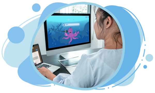 Student playing educational spelling game on computer.